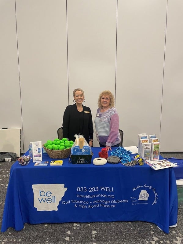 Coalition educational booth with Be Well Arkansas materials